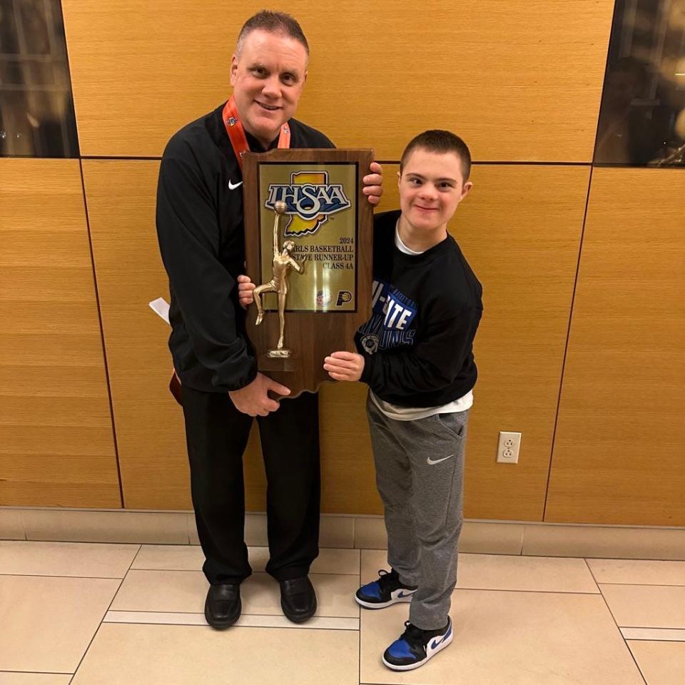 Brendan Huppenthal poses for a photo with his uncle, Lake Central coach Joe Huppenthal, following the Class 4A state championship game on Saturday, Feb. 24, 2024 at Gainbridge Fieldhouse.