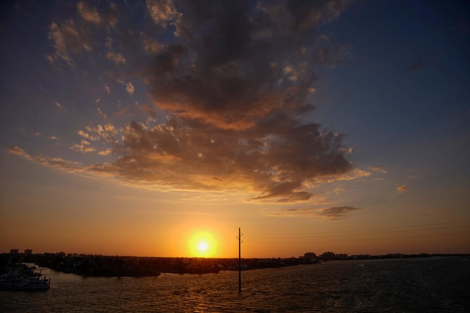The view of the sunset is shown from the Judge S.S. Jolley Bridge in Marco Island on Tuesday, March 7, 2023.