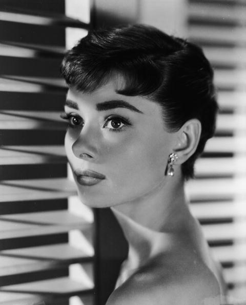 <p>Audrey Hepburn was always one for setting hair trends, but none were more iconic than her pixie for her 1954 film, <em>Sabrina. </em>Her micro-bangs gave it a bold, modern vibe — and the style caught on like wildfire. </p>