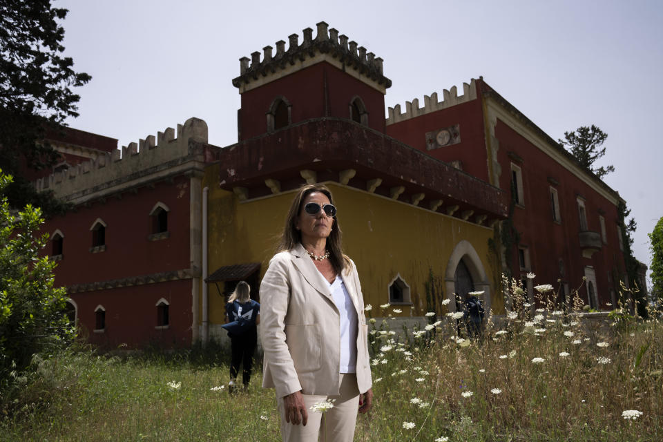 Head of Anti Mafia force (DIA), Carla Durante, walks with her team in Lazzari Castle confiscated to a convicted man from the SCU in 2013, in Cutrofiano, near Lecce, Italy, Tuesday, May 21, 2024. (AP Photo/Alessandra Tarantino)