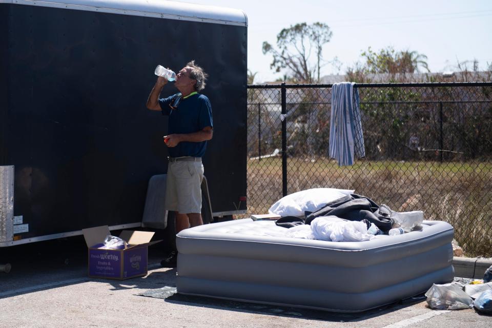 Kurt Bartholomew spends part of his day volunteering for an aid distribution center operated by disaster aid organization, the Cajun Navy Ground Force, and the other part of his day camped outside at the Fort Myers, Fla, Wal-Mart parking lot on Friday, October 7, 2022. Bartholomew was relocated to the parking lot just before Hurricane Ian hit Fort Myers Beach, where he was living. Saul Young/Knoxville News Sentinel-USA TODAY NETWORK