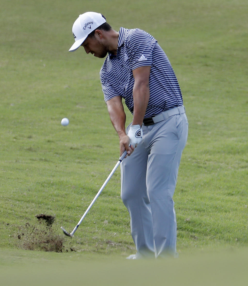 Xander Schauffele hits onto the 10th green during the final round of the Tournament of Champions golf event, Sunday, Jan. 6, 2019, at Kapalua Plantation Course in Kapalua, Hawaii. (AP Photo/Matt York)