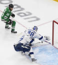 Tampa Bay Lightning defenceman Victor Hedman (77) reaches to clear the puck behind Lightning goaltender Andrei Vasilevskiy (88) as Dallas Stars center Joe Pavelski (16) watches during the third period of Game 4 of the NHL hockey Stanley Cup Final, Friday, Sept. 25, 2020, in Edmonton, Alberta. (Jason Franson/The Canadian Press via AP)