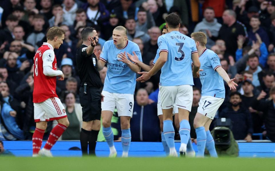 Manchester City's Erling Braut Haaland with teammates remonstrate with referee Michael Oliver - REUTERS/Phil Noble