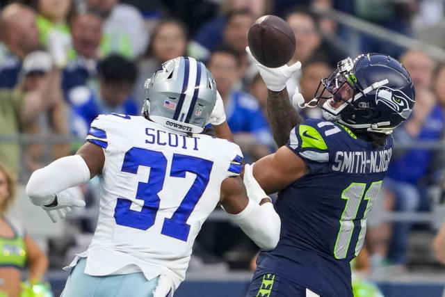 DeeJay Dallas of the Seattle Seahawks gestures to the fans during