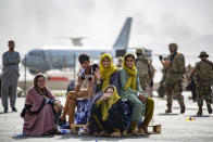 In this image provided by the U.S. Marines, evacuee children wait for the next flight after being manifested at Hamid Karzai International Airport, in Kabul, Afghanistan, Thursday, Aug. 19, 2021. (1st Lt. Mark Andries/U.S. Marine Corps via AP)
