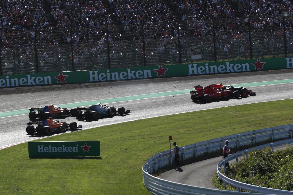 Drivers take a turn during the Formula One Japanese Grand Prix final at Suzuka on October 13, 2019. (Photo by Behrouz MEHRI / AFP) (Photo by BEHROUZ MEHRI/AFP via Getty Images)