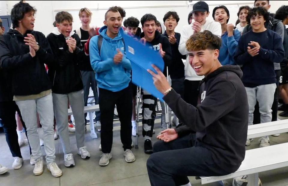 The team cheers after Clovis North’s Bryan Lopez was surprised by being named the Bee’s Boys Soccer Player of the Year Tuesday, March 28, 2023 in Fresno.