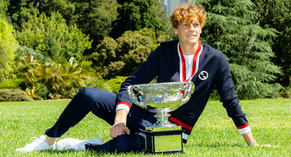 Seen here, Jannik Sinner poses with the Australian Open men's trophy.