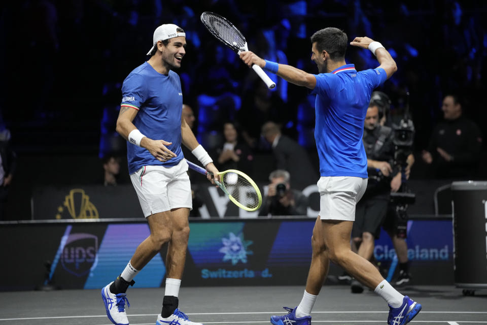 Team Europe's Novak Djokovic and Matteo Berrettini celebrate after winning a match against Team World's Jack Sock and Alex de Minaur on second day of the Laver Cup tennis tournament at the O2 in London, Saturday, Sept. 24, 2022. (AP Photo/Kin Cheung)