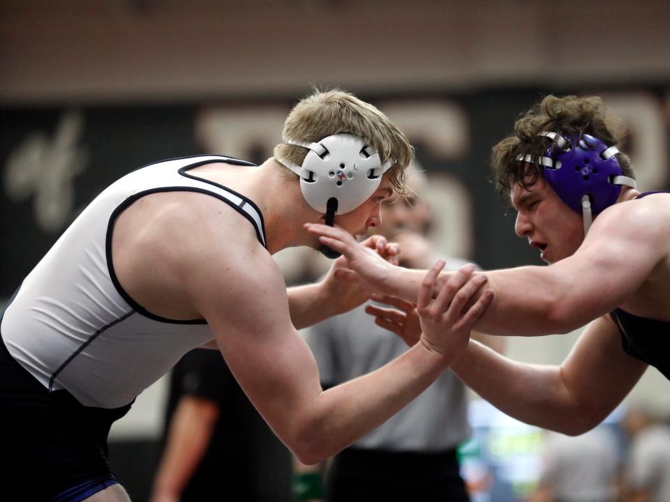 River View senior Cruz Mobley, left, tries to gain hand control over Greenfield McClain's Ethan Hill during the consolation finals of the Division II district tournament on Saturday at Steubenville High School. Mobley won the match by pin with four seconds left in the match to place third and advance to his second straight state tournament.