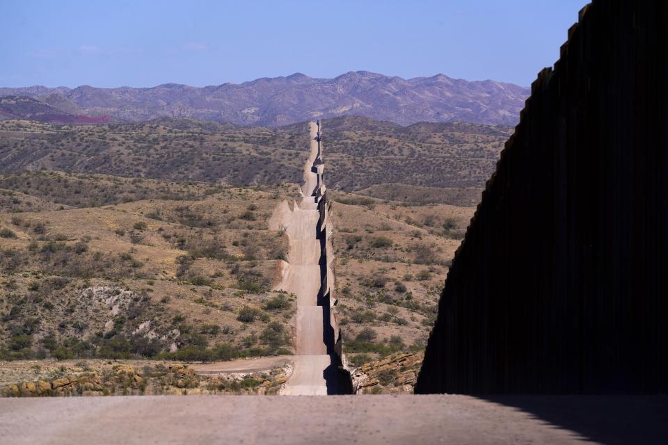 The border wall stretches along the landscape near Sasabe, Ariz. on May 19, 2021. (Ross D. Franklin/AP)