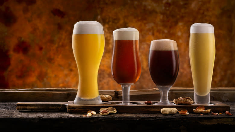 Four different beer styles with peanuts
