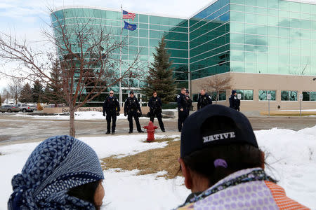 Opponents of the Dakota Access oil pipeline rally outside the Bank of North Dakota in Bismarck, North Dakota, U.S., January 31, 2017. REUTERS/Terray Sylvester