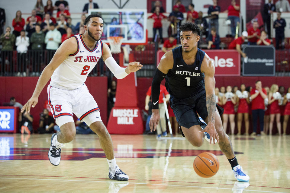 Butler forward Jordan Tucker (1) drives past St. John's guard Julian Champagnie (2) during the first half of an NCAA college basketball game Tuesday, Dec. 31, 2019, in New York. (AP Photo/Julius Constantine Motal)