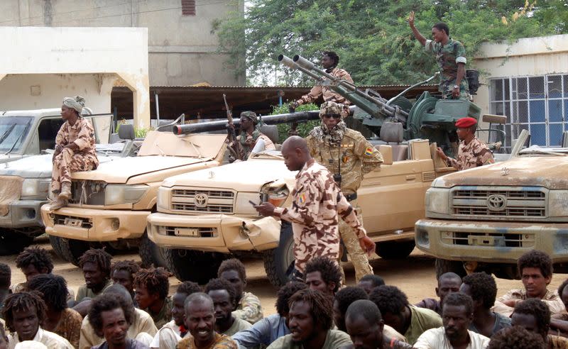 Captured FACT rebels and vehicles are pictured at army headquarters in N'Djamena