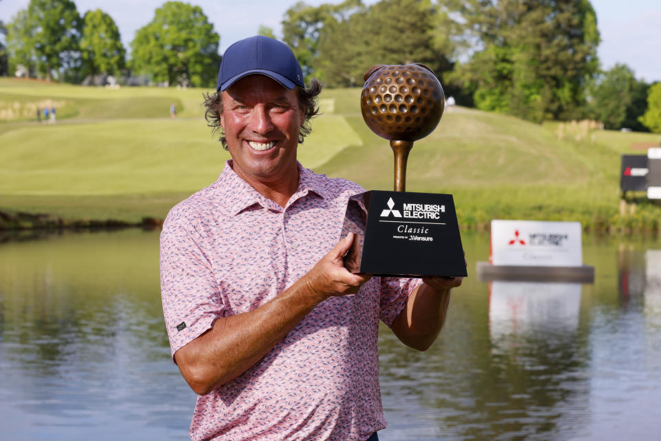 Stephen Ames shows the trophy to the media after winning the Mitsubishi Classic senior golf tournament at TPC Sugarloaf on Sunday, April 28, 2024, in Duluth, Ga. (Miguel Martinez/Atlanta Journal-Constitution via AP)