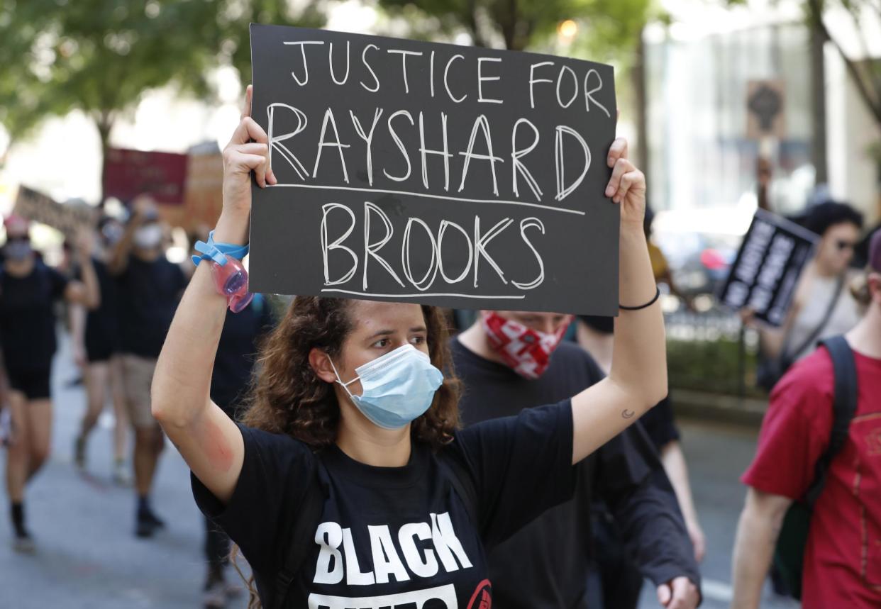 Protesters gather at Centennial Olympic Park after an overnight Atlanta Police Department officer-involved shooting which left a black man dead at a Wendy's restaurant in Atlanta, Georgia, 13 June 2020: EPA/ERIK S. LESSER