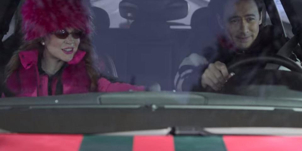 sierra and tad riding in a car in falling for christmas