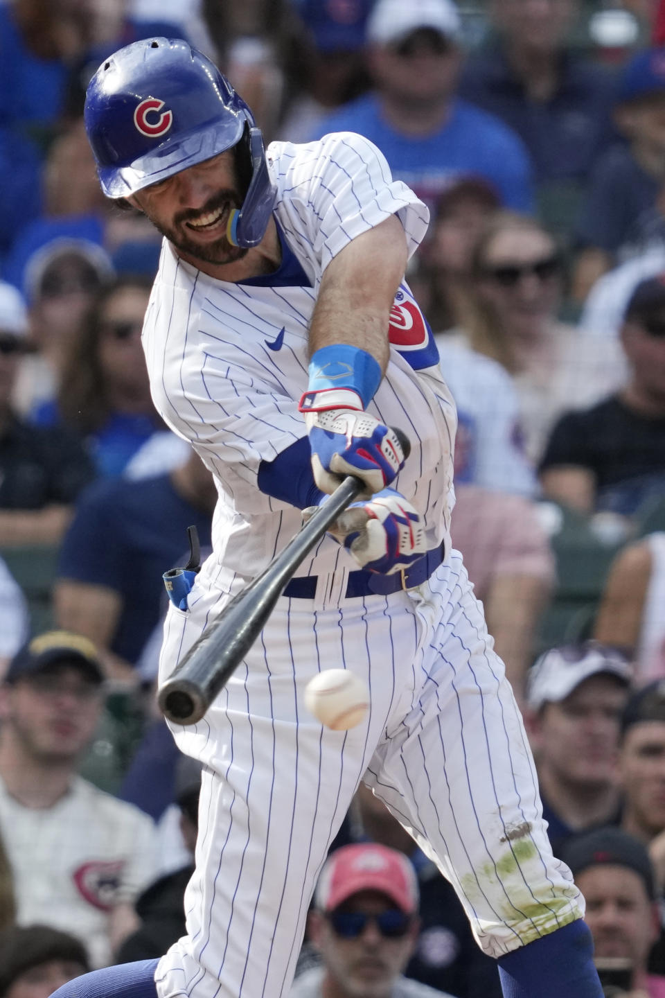 Chicago Cubs' Dansby Swanson hits a one-run single during the seventh inning of a baseball game against the Colorado Rockies in Chicago, Friday, Sept. 22, 2023. (AP Photo/Nam Y. Huh)