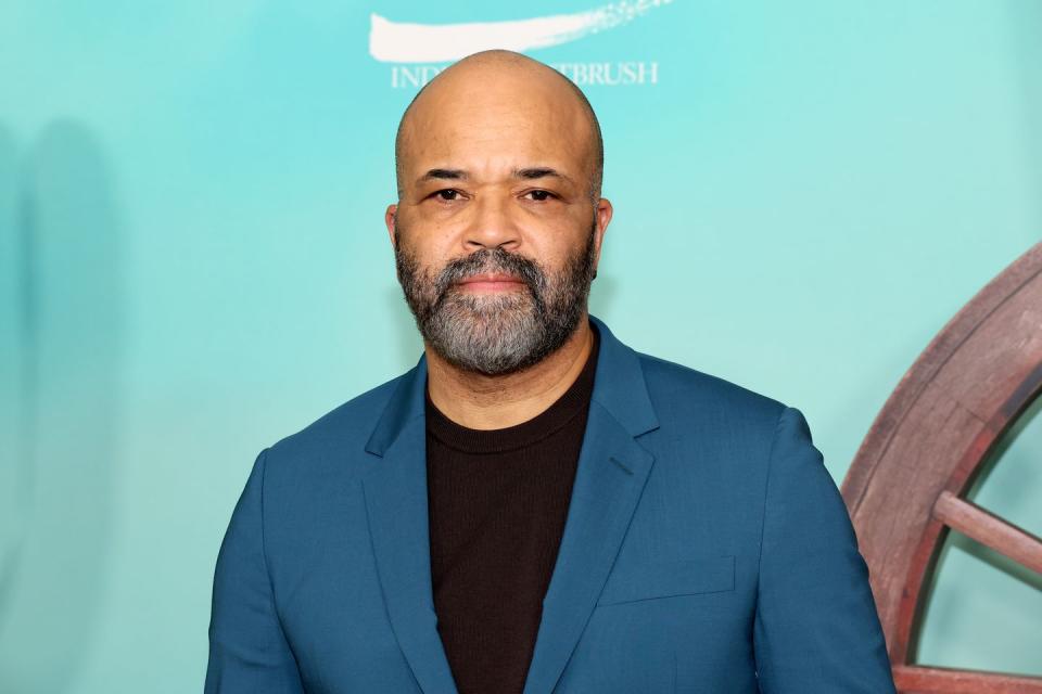 jeffrey wright attends the asteroid city premiere wearing a dark teal jacket and a black top