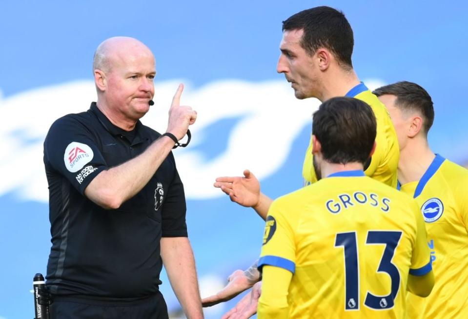 <p>Lewis Dunk remonstrates with Referee Lee Mason</p> (Getty)