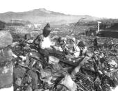 FILE - In this Sept. 24, 1945, file photo, released by U.S. Marines, a battered religious figure stands witness on a hill above a burn-razed valley at Nagasaki, Japan, after the second atomic bomb ever used in warfare was dropped by the U.S. over the Japanese industrial center. The city of Nagasaki in southern Japan marks the 75th anniversary of the U.S. atomic bombing of Aug. 9, 1945. (U.S Marines via AP, File)