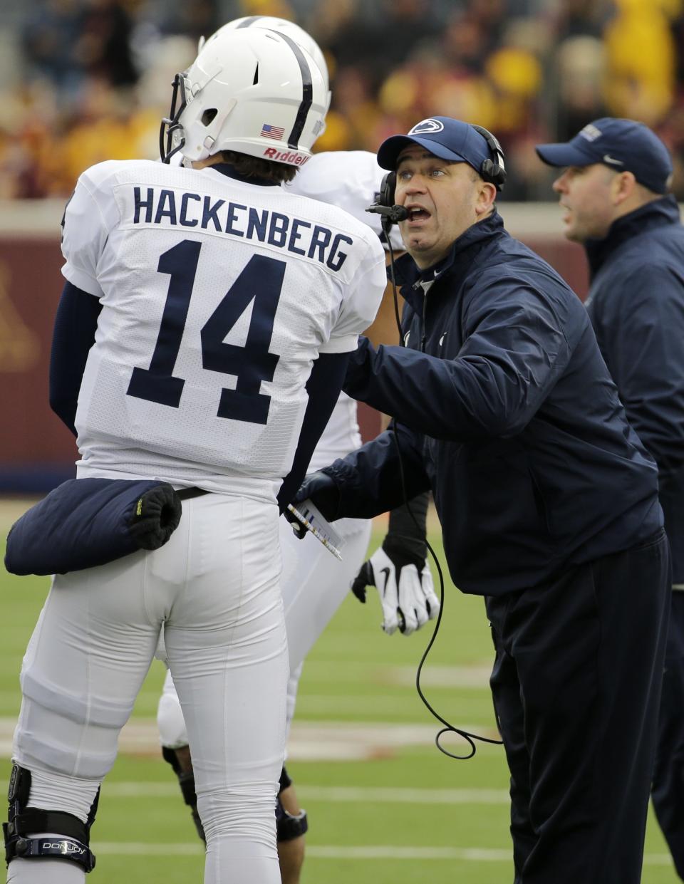 Penn State head coach Bill O'Brien, right, talks with quarterback Christian Hackenberg during the first quarter of an NCAA college football game in Minneapolis Saturday, Nov. 9, 2013. (AP Photo/Ann Heisenfelt)