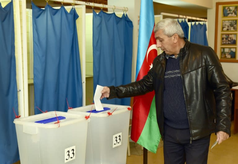 A man casts his ballot at a polling station in Baku on November 1, 2015