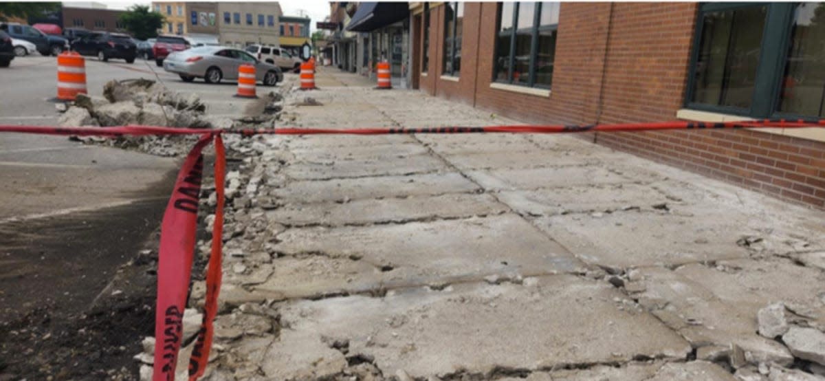 A sidewalk on the Macomb downtown square has been roped off in advance of planned work Monday.