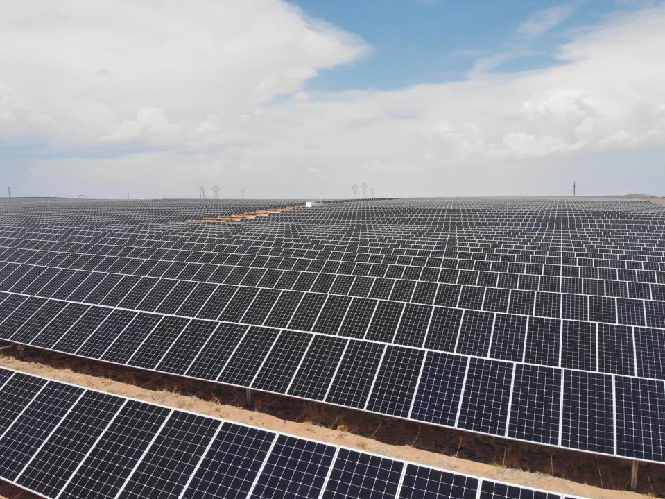 FILE - This June 15, 2021 photo shows a Public Service Co. of New Mexico solar farm west of Rio Rancho, N.M. The utility in sun-drenched New Mexico is struggling to get enough solar-generated electricity as it prepares to shut down a coal-fired power plant amid supply chain disruptions, one of the problems threatening to delay or cancel projects around the world amid pressure to reduce carbon emissions and tackle climate change. Public Service Co. of New Mexico initially proposed replacing the lost capacity with a mix of natural gas, solar and battery storage. The Public Regulation Commission instead opted for solar and storage to make up some of the difference after environmentalists pushed back on gas. (AP Photo/Susan Montoya Bryan, File)