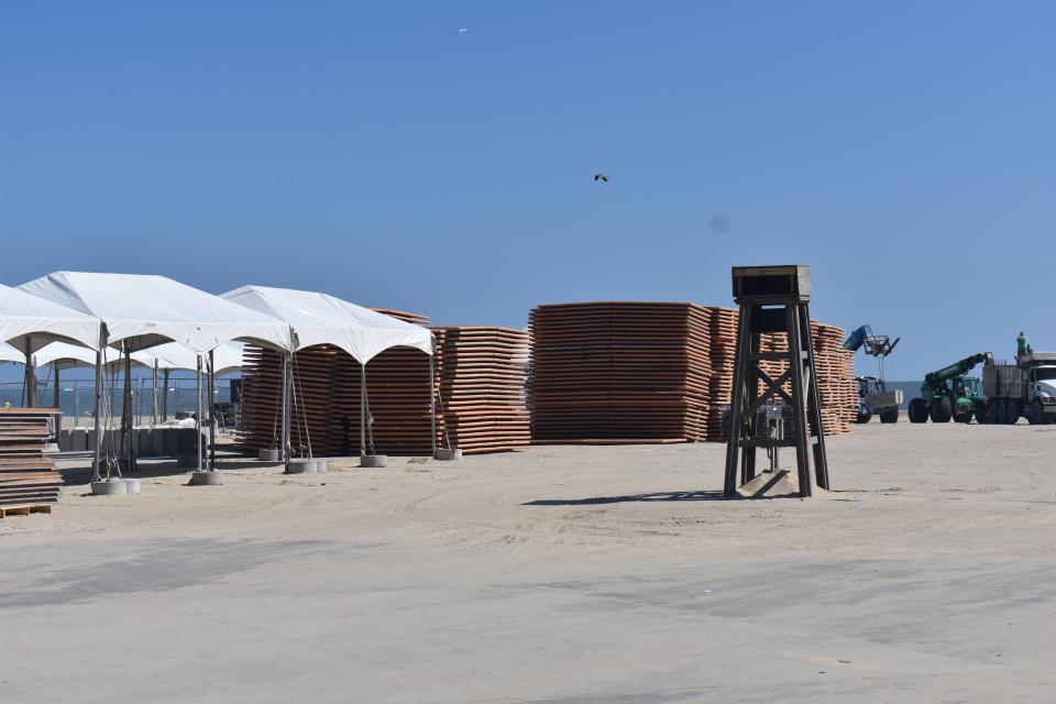 Workers tear down stages, bleachers and tents on Tuesday, October 3, 2023, after a successful inaugural Oceans Calling Festival on the Boardwalk in Ocean City, Maryland.