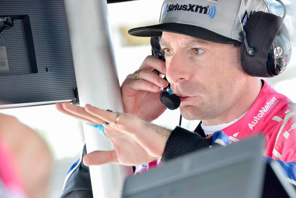 Meyer Shank Racing driver Simon Pagenaud (60) talks in his pit box Wednesday, May 17, 2023, during the second day of practice for the Indianapolis 500 at Indianapolis Motor Speedway. 
