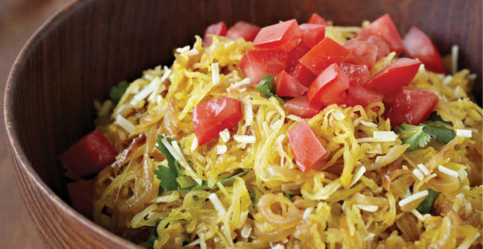 <p>Parade</p><p>In this recipe, strands of baked spaghetti squash are the backdrop for sweet caramelized onions that contrast against salty, savory Parmesan cheese.</p><p><a href="/27631/drmarwansabbaghandbeaumacmillan/spaghetti-squash-with-caramelized-onion-and-tomato/" data-ylk="slk:Get the recipe here!;elm:context_link;itc:0;sec:content-canvas" class="link "><em><strong>Get the recipe here!</strong></em></a></p>