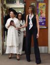 <p>The First Lady and Peng Liyuan, wife of the Chinese President, toured four classes at Bak Middle School of the Arts. Melania Trump took on a stylish look with her dark navy pantsuit and floral scarf.</p>