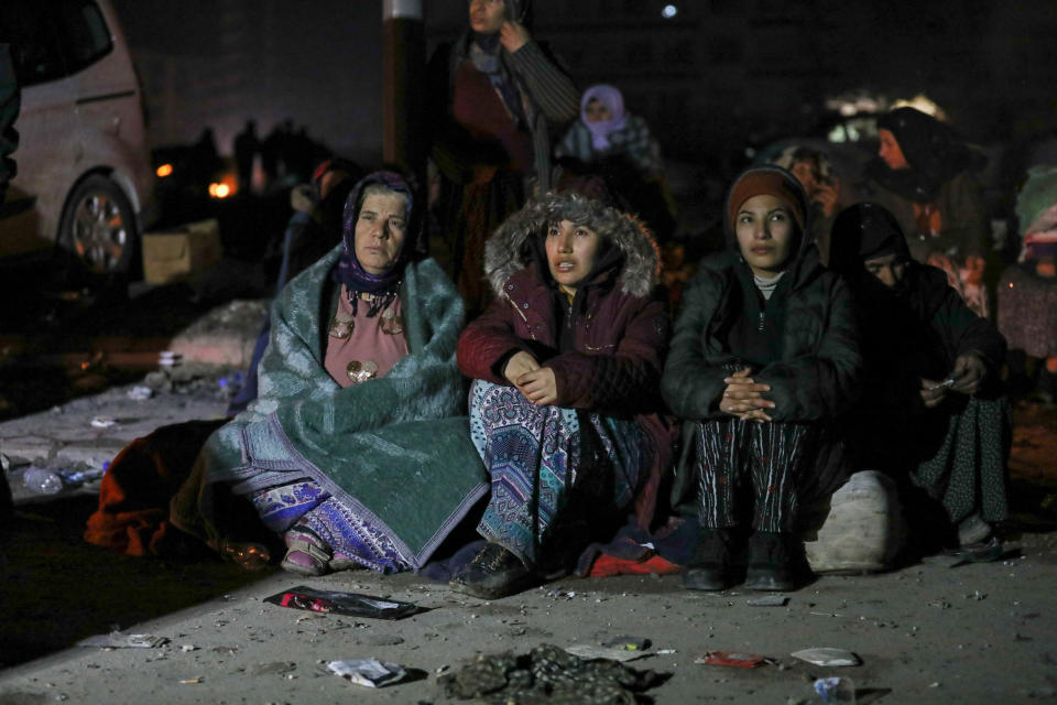 HATAY, TURKEY - 2023/02/07: People seen waiting in the earthquake zone. Turkey experienced the biggest earthquake of this century in the border region with Syria. The earthquake was measured at 7.7 magnitude. (Photo by Tunahan Turhan/SOPA Images/LightRocket via Getty Images)