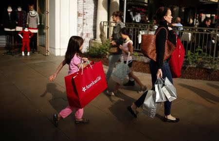 People shop at The Grove mall in Los Angeles November 26, 2013. REUTERS/Lucy Nicholson