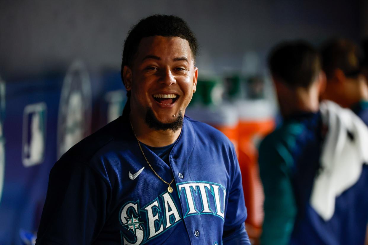 Seattle Mariners starting pitcher Luis Castillo (21) celebrates in the dugout following the top of the eighth inning against the New York Yankees at T-Mobile Park on Aug. 9.