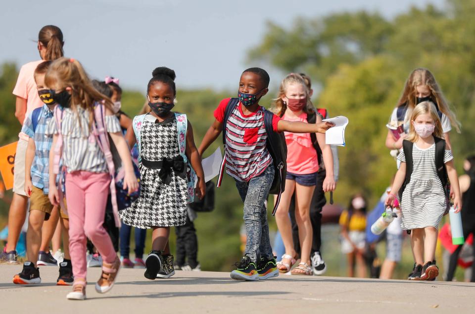 Students at the Timber Ridge Elementary in Johnston leave school on Thursday, Sept. 24, 2020.