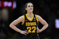 Iowa guard Caitlin Clark stands on the court during the second half of the Final Four college basketball championship game against South Carolina in the women's NCAA Tournament, Sunday, April 7, 2024, in Cleveland. (AP Photo/Carolyn Kaster)