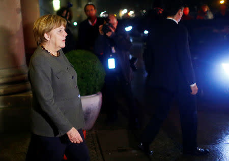 German Chancellor Angela Merkel of the Christian Democratic Union (CDU) leaves the German Parliamentary Society after exploratory talks about forming a new coalition government in Berlin, Germany, November 17, 2017. REUTERS/Hannibal Hanschke