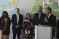 Broward county Mayor Michael Udine speaks during a news conference at the Brightline station in Fort Lauderdale, Fla., on Monday, Aug., 15, 2022. Looking on is U.S Rep. Shiela Cherfilus-McCormick, D-Fla., U.S. Rep. Mario Diaz Ballart, R-Fla., U.S. Rep. Debbie Wasserman Schultz, D-Fla., and Brightline CEO Patrick Goddard. The Florida Department of Transportation and Brightline was awarded a $25 million grant to enhance safety along the Florida East Coast Railway- Brightline corridor between Miami-Dade and Brevard counties. (Joe Cavaretta/South Florida Sun-Sentinel via AP)