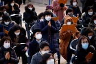 Buddhist believers pray for their children’s success in the college entrance examinations amid the coronavirus disease (COVID-19) pandemic, at a Buddhist temple in Seoul