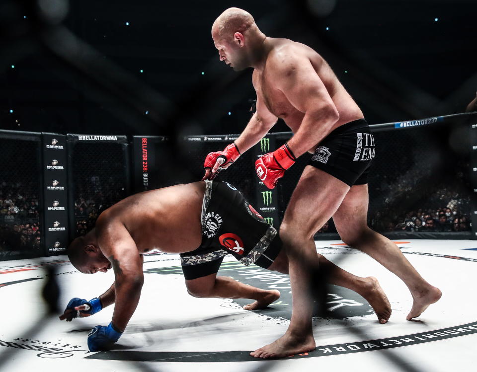 SAITAMA, JAPAN - DECEMBER 29, 2019: American MMA fighter Quinton 'Rampage' Jackson (L) and his Russian rival Fedor Emelianenko struggle in their Bellator 237 heavyweight main event at Saitama Super Arena; Bellator 237 is a cross-promotional event between Bellator MMA and the Rizin Fighting Federation. Valery Sharifulin/TASS (Photo by Valery Sharifulin\TASS via Getty Images)