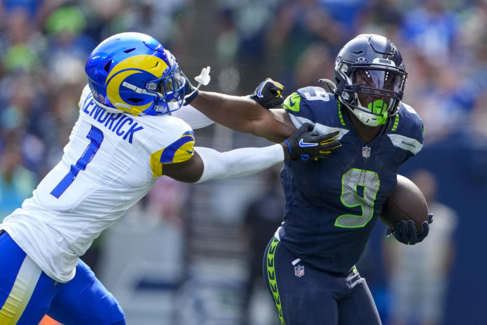 Seattle Seahawks running back Kenneth Walker III runs around Los Angeles Rams cornerback Derion Kendrick during the first half of an NFL football game Sunday, Sept. 10, 2023, in Seattle. (AP Photo/Lindsey Wasson)