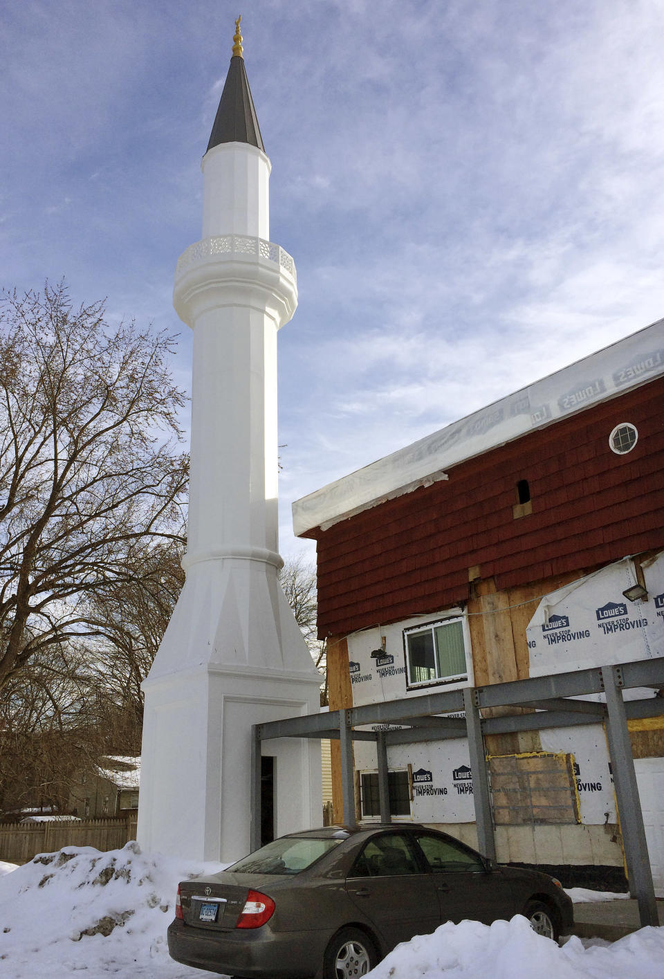 Construction at a mosque being built with support from the Turkish-American Religious Foundation sits suspended, Tuesday, Feb. 14, 2017, in New Haven, Conn. The city halted construction of a mosque in November because two minarets sent from Turkey are 24 feet too tall. City officials say it's up to the mosque owner, the Turkish-American Religious Foundation, to figure out how to make the 81-foot-tall towers smaller. (AP Photo/Michael Melia)