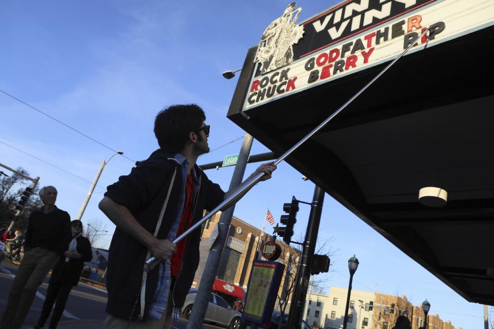 Teddy Kogos of Vintage Vinyl changes the marquis at the famed record store on the Delmar Loop in St. Louis to mark the death of music legend Chuck Berry on Saturday, March 18, 2017. Earlier in the day, police announced Berry died at the age of 90. (David Carson/St. Louis Post-Dispatch via AP)