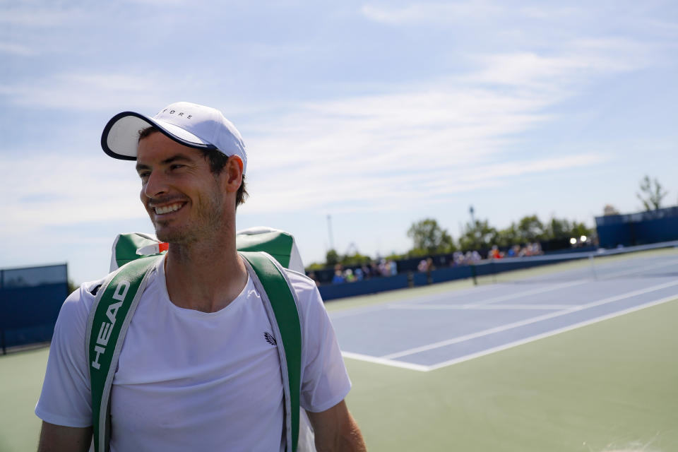 Andy Murray, of Britain, smiles after practice at the Western & Southern Open tennis tournament, Sunday, Sunday, Aug. 11, 2019, in Mason, Ohio. (AP Photo/John Minchillo)