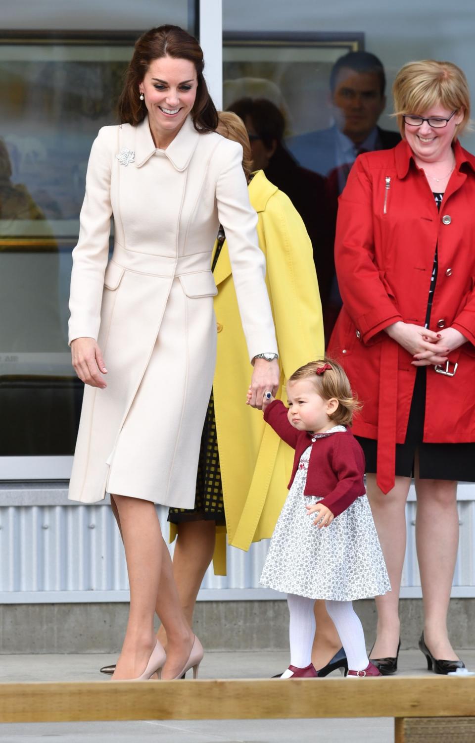 <p>The royal family's tour of Canada saw Kate appear in some memorable looks. This elegant nude coat – complete with a feminine collar and emblematic maple leaf brooch – was the perfect outfit to bid farewell to the country. <i>[Photo: PA]</i> </p>