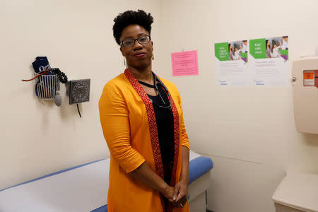 Doctor Omolara Uwemedimo, a pediatrician at Cohen's Children's Medical Center, poses at a clinic in New Hyde Park, New York, U.S., February 13, 2018. Picture taken February 13, 2018. REUTERS/Shannon Stapleton